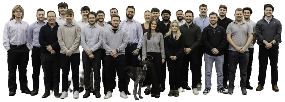 The GS Group team standing together at the Pangbourne office, with a dog in the front row